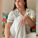 Women's white cotton pajamas with black trim